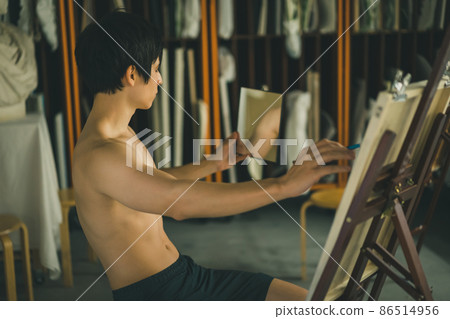 A man drawing a self-portrait 86514956