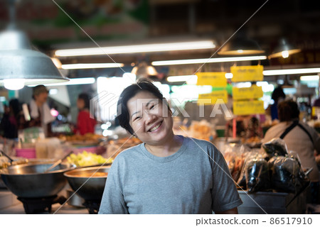 Woman at Thai street food in market 86517910