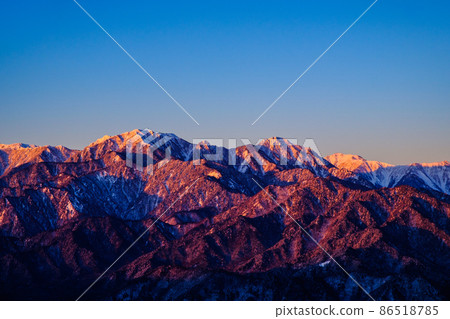 Mt. Gaki and Mt. Karasawa dyed in Morgenroth (from Mt. Takagari in winter) 86518785