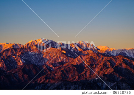 Mt. Gaki and Mt. Karasawa dyed in Morgenroth (from Mt. Takagari in winter) 86518786