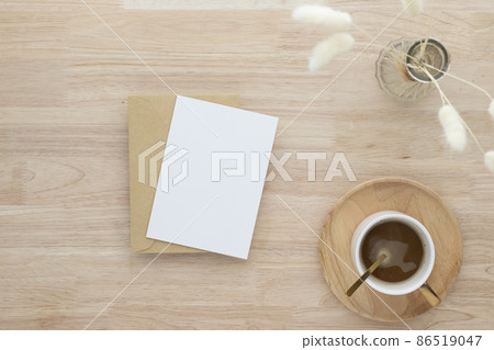 Blank paper cards, Blank greeting card invitation Mockup with Dried Bunny Tail grass in vase and coffee cup on wood table, wood desk background, Minimal wood table workplace composition, flat lay, Blank paper cards, Blank greeting card invitation Mockup with Dried Bunny Tail grass in vase and coffee cup on wood table, wood desk background, Minimal wood table workplace composition, flat lay, 86519047