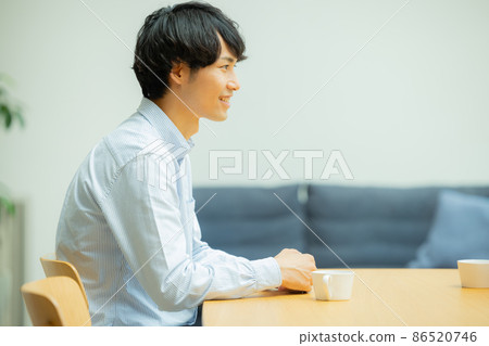 A man talking in the living room A man talking in the living room 86520746