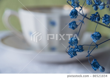 Blue gypsophila on the background of a cup Blue gypsophila on the background of a cup 86521834