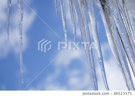 Icicles and blue sky Icicles and blue sky 86523575