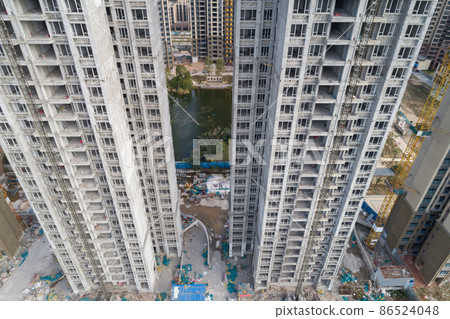 Aerial view of apartment construction site in China 86524048
