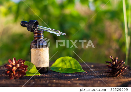 Bottle of herbal infusion and a pipette. Copy space Bottle of herbal infusion and a pipette. Copy space 86529999