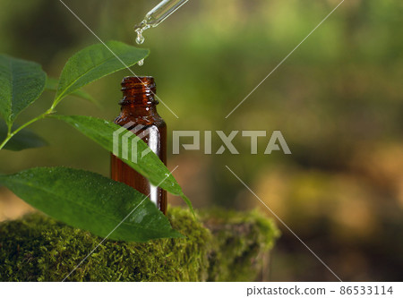 Water drop falling from a pipette to the bottle 86533114