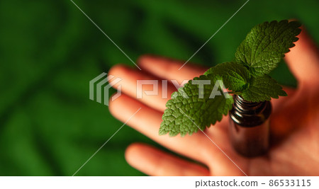 Altenativ medicine, hand and bottle. 86533115