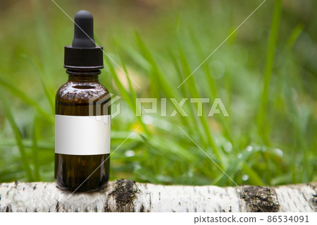 Birch tree extract - a bottle with a dropper. Birch tree extract - a bottle with a dropper. 86534091