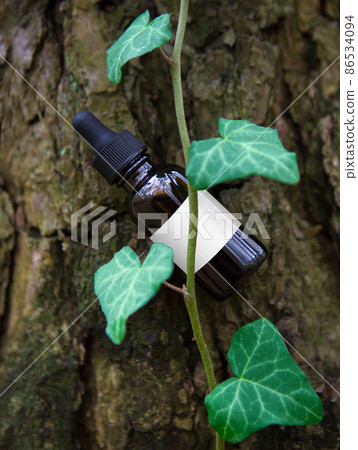 Medical bottle with herbal extract - concept 86534094