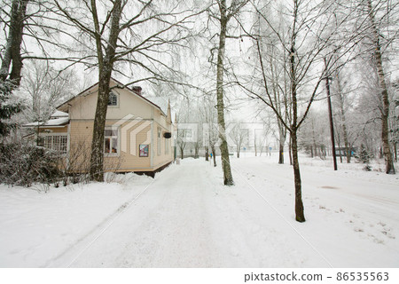 Colorful wooden house snowed in Finland Colorful wooden house snowed in Finland 86535563