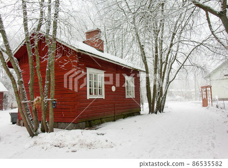 Colorful wooden houses snowed in Finland Colorful wooden houses snowed in Finland 86535582