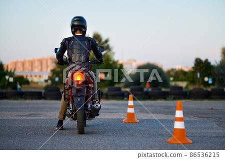 Student on motorbike, back view, motorcycle school Student on motorbike, back view, motorcycle school 86536215