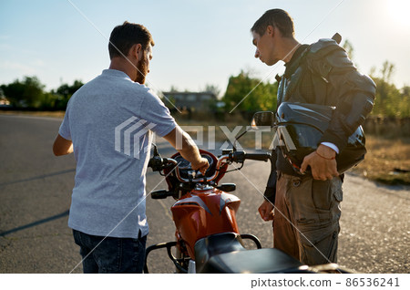Male student and instructor, lesson in motorschool Male student and instructor, lesson in motorschool 86536241