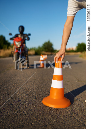 Snake riding between the cones, motorcycle school Snake riding between the cones, motorcycle school 86536245
