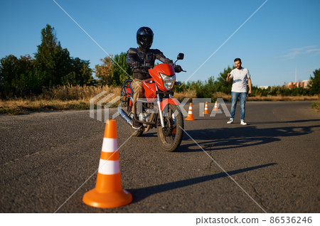 Student and instructor, exam in motorcycle school Student and instructor, exam in motorcycle school 86536246