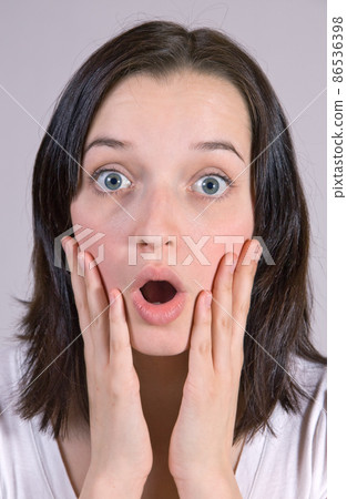 A astonished face of a young woman A astonished face of a young woman 86536398
