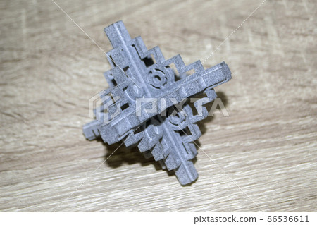 Gray abstract models printed on 3d printer from powder close-up. Gray abstract models printed on 3d printer from powder close-up. 86536611
