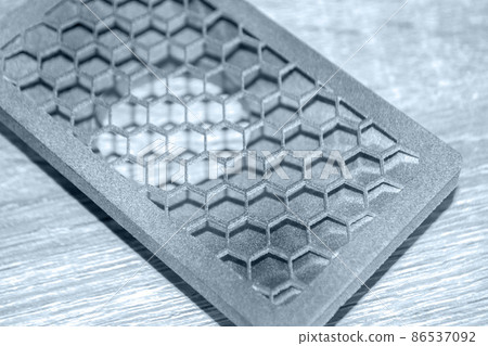 Gray abstract model printed on 3d printer from powder on background. Gray abstract model printed on 3d printer from powder on background. 86537092