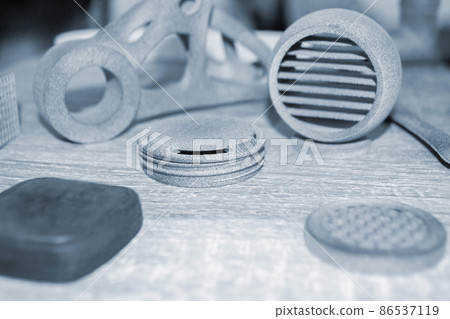 Different objects printed on industrial powder 3D printer. Multi Jet Fusion MJF 86537119