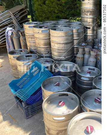 Steel industrial barrels of beer stocked in storage Steel industrial barrels of beer stocked in storage 86537502