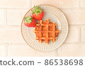 Strawberries and waffles 86538698