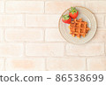 Strawberries and waffles 86538699