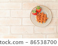 Strawberries and waffles 86538700