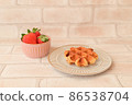 Strawberries and waffles 86538704