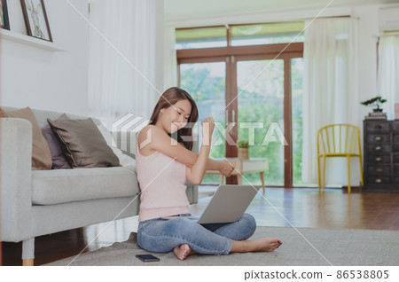 Asian woman stretching after working at home 86538805