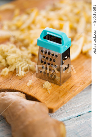 grated ginger and lemon grated ginger and lemon 86539693