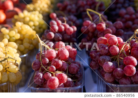 Grapes close-up. Selective and soft focus. Ripe and juicy grapes are sold at the farmers bazaar Grapes close-up. Selective and soft focus. Ripe and juicy grapes are sold at the farmers bazaar 86540956