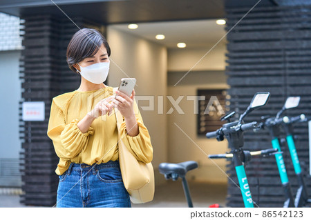 Female driving an electric kickboard 86542123