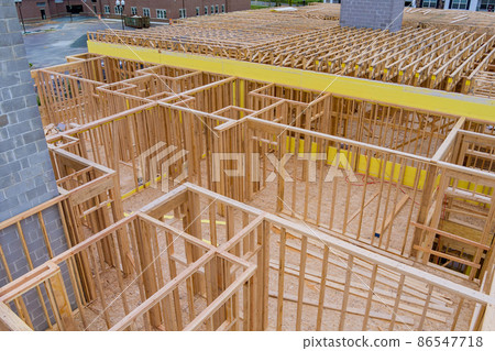 Apartment building wood second floor joist in a new construction site Apartment building wood second floor joist in a new construction site 86547718