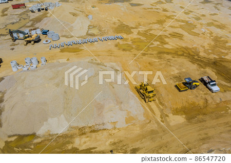 Aerial view stacked pipe at concrete drainage pipes for building with preparation land for construction site Aerial view stacked pipe at concrete drainage pipes for building with preparation land for construction site 86547720