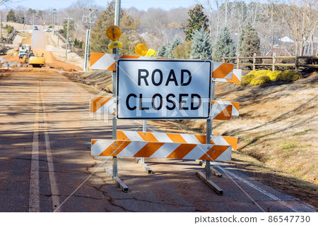 Road closed sign on the street barricade 86547730