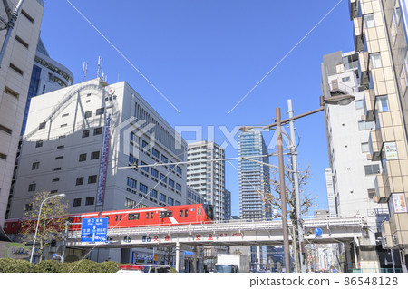 Contrast between the red train on the Marunouchi line and the buildings Hakusan-dori, Bunkyo-ku, Tokyo Contrast between the red train on the Marunouchi line and the buildings Hakusan-dori, Bunkyo-ku, Tokyo 86548128