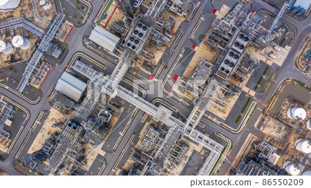 Oil refinery plant at industrial zone, Aerial view oil and gas business petrochemical industrial, Oil refinery factory white oil storage tank and pipeline steel, Ecosystem and healthy environment. 86550209