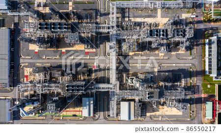 Oil refinery plant at industrial zone, Aerial view oil and gas business petrochemical industrial, Oil refinery factory white oil storage tank and pipeline steel, Ecosystem and healthy environment. 86550217