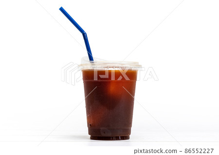 black coffee or ice americano in a cup with blue straw on white background black coffee or ice americano in a cup with blue straw on white background 86552227