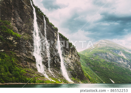 Geirangerfjord, Norway. The Seven Sisters waterfalls In Geirangerfjorden. Famous Norwegian Landmark And Popular Destination In Summer Day.Geirangerfjord, Norway. The Seven Sisters waterfalls In Geirangerfjord, Norway. The Seven Sisters waterfalls In Geirangerfjorden. Famous Norwegian Landmark And Popular Destination In Summer Day.Geirangerfjord, Norway. The Seven Sisters waterfalls In 86552253