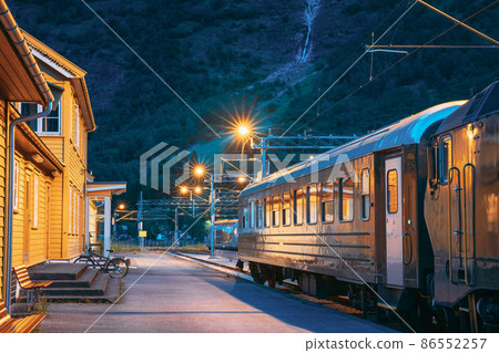 Flam, Norway. Famous Railroad Flamsbahn. Green Norwegian Train Near Railway Station. Electric trainFlam, Norway. Famous Railroad Flamsbahn. Green Norwegian Train Near Railway Station. Electric train. Flam, Norway. Famous Railroad Flamsbahn. Green Norwegian Train Near Railway Station. Electric trainFlam, Norway. Famous Railroad Flamsbahn. Green Norwegian Train Near Railway Station. Electric train. 86552257