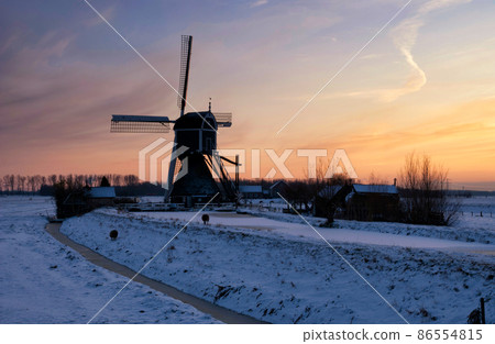Windmill the Wingerdse Molen under a colorful sky Windmill the Wingerdse Molen under a colorful sky 86554815