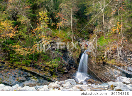 Small waterfall near the Swiss village Vulpera Small waterfall near the Swiss village Vulpera 86554818