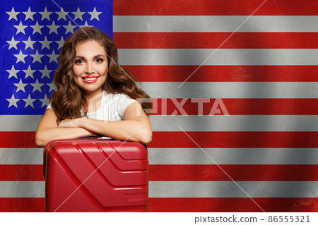 Happy smart woman with backpack against USA flag background 86555321