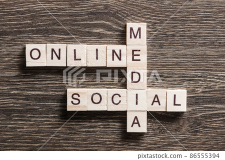 Conceptual business keywords on table with elements of game making crossword 86555394