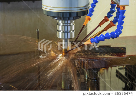 The CNC milling machine cutting the mold parts with oil coolant method. The CNC milling machine cutting the mold parts with oil coolant method. 86556474