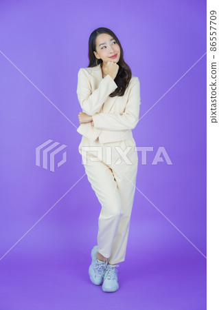 Portrait beautiful young asian woman smile with action Portrait beautiful young asian woman smile with action 86557709