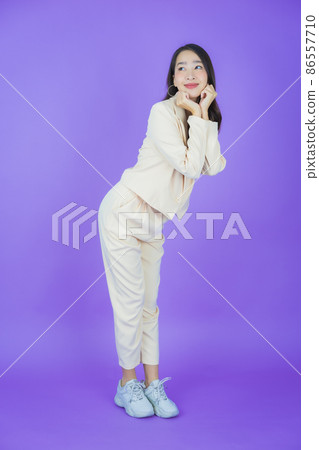 Portrait beautiful young asian woman smile with action Portrait beautiful young asian woman smile with action 86557710