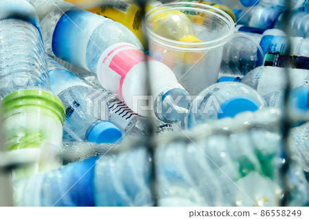 Plastic bottles and containers prepared for recycling Plastic bottles and containers prepared for recycling 86558249